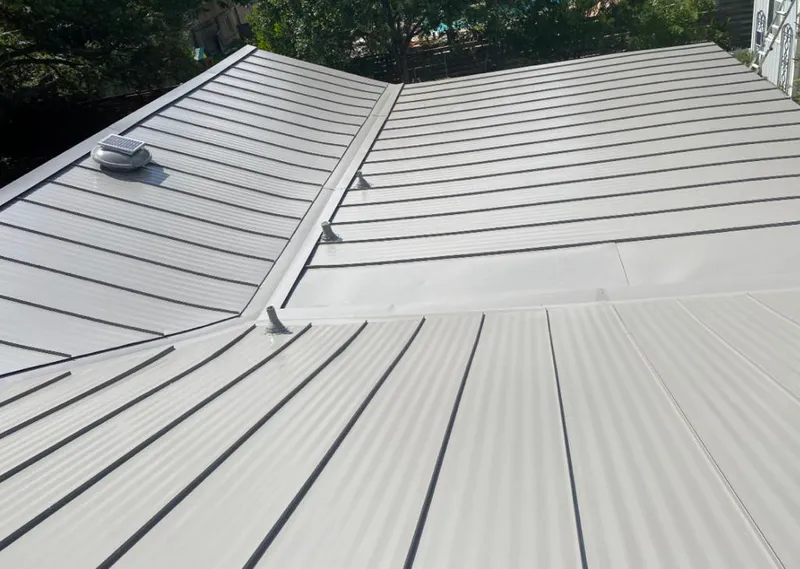 Solar attic fan installed on a metal roof for Roof Ventilation in Middle Valley